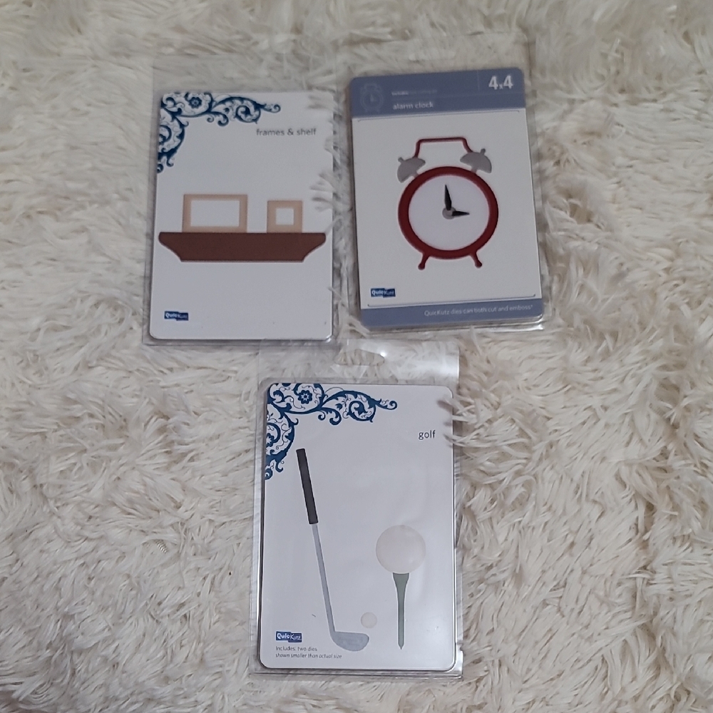 Muji Red Alarm Clock, Brown Frames, and White Golf Pen Set